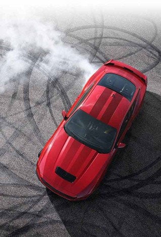 Overhead view of a 2024 Ford Mustang® model with tire tracks on pavement | Crossroads Ford Ravena in Ravena NY