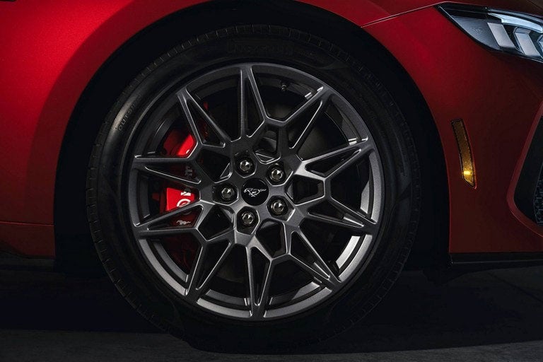 2024 Ford Mustang® model with a close-up of a wheel and brake caliper | Crossroads Ford Ravena in Ravena NY